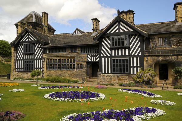 Shibden Hall ©Shutterstock /Alastair Wallace View of exterior of half-timbered Shibden Hall, with decorative flower beds in foreground