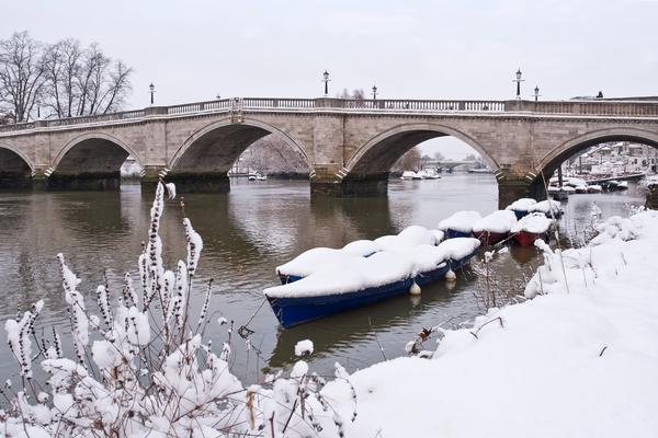 Richmond Bridge in Winter ©Shutterstock /Patrick Wang Richmond bridge and boats on the River Thames in Richmond, covered by snow