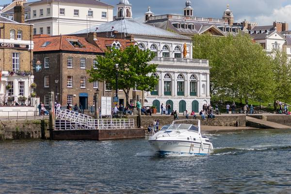 Richmond River Scene ©Shutterstock /Philip Bird LRPS CPAGB Motorboat passing Richmond on the River Thames