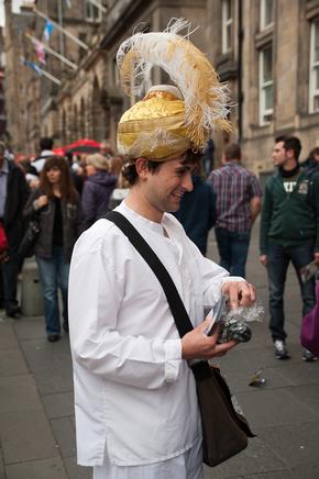 Person dressed as sultan giving out flyers
