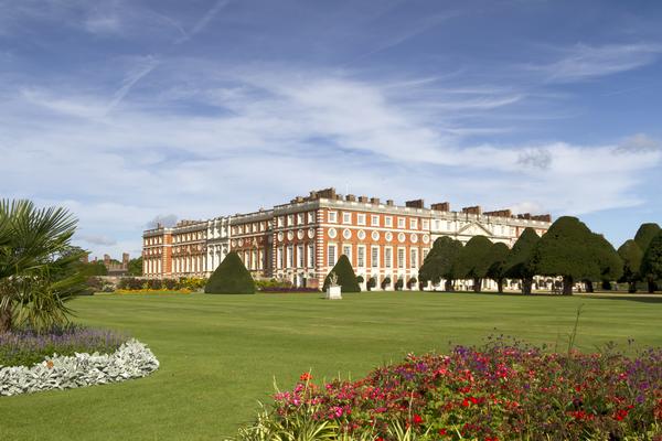 Exterior of Hampton Court Palace showing gardens in foreground