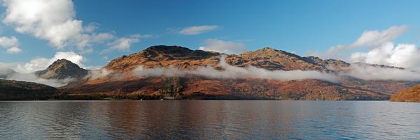 Mist rising above the mountains of Arrochar at Loch Lomond