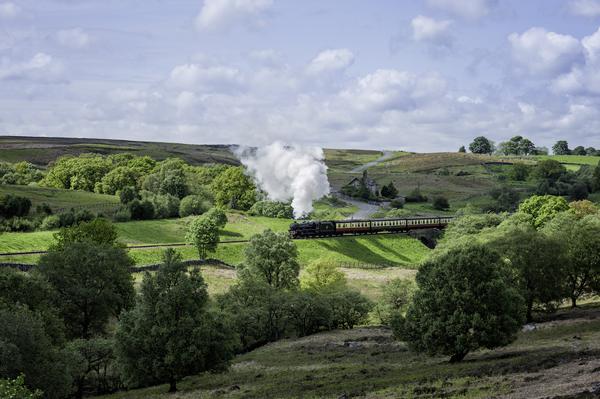 View of a vintage steam train travelling from Goathland to Pickering on the North York Moors Railway