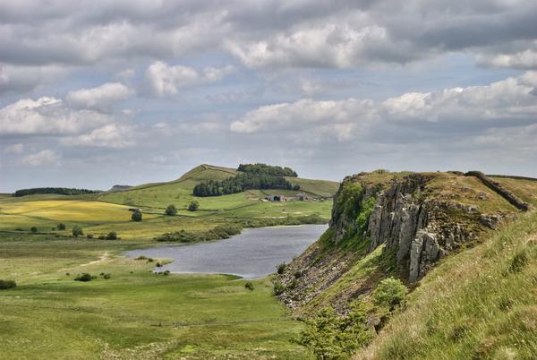 Looking along Hadrian's Wall with Crag Lough lake in the distance