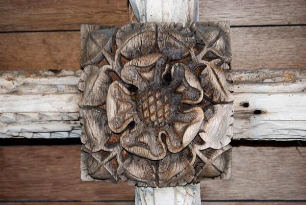 A Tudor rose carved on a church ceiling