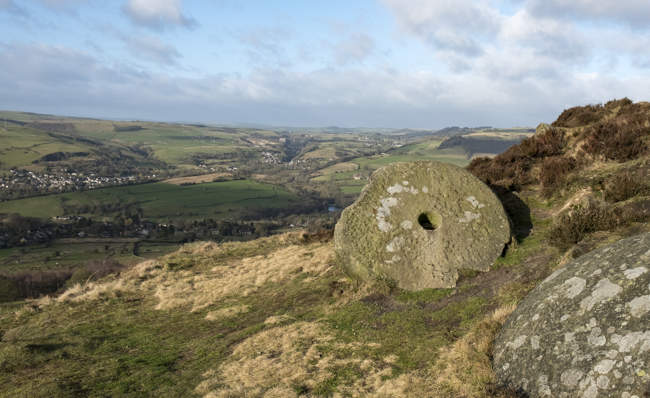 Old abandoned millstone in the Derbyshire Peak District