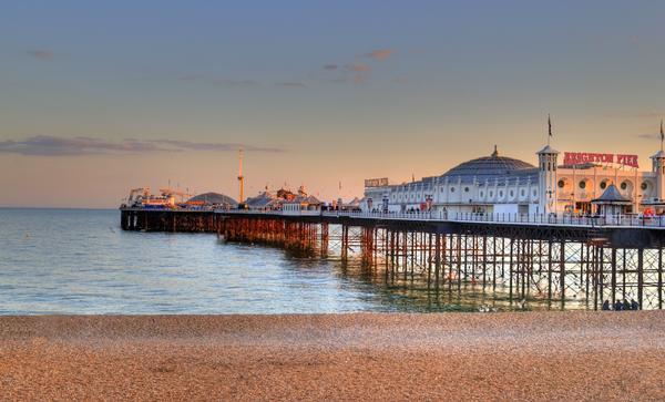 © Shutterstock / Mitotico Brighton Pier viewed from the beach at sunset