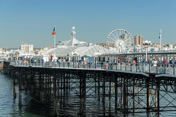 © Shutterstock / Steve Mann The attractions on Brighton Pier viewed from the sea end