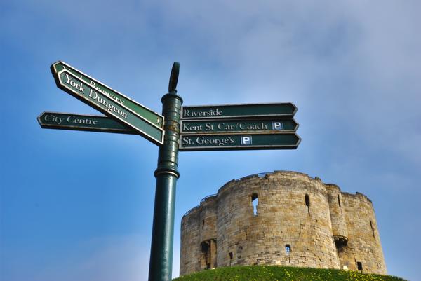 Cliffords Tower against blue sky showing the quatrefoil design of the keep