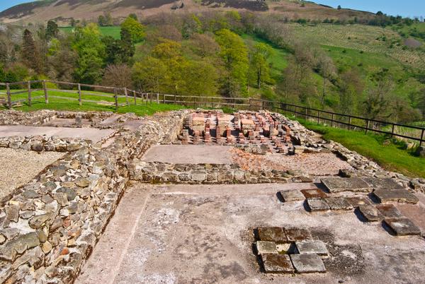 © Shutterstock / Jule_Berlin Ruins at Housesteads Roman Fort, with re-constructed buildings in the background