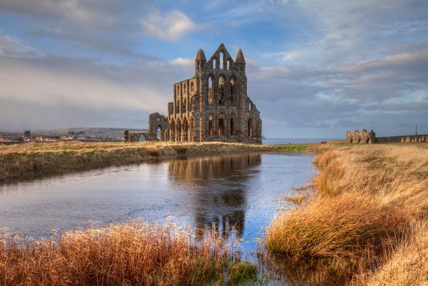 Distant view of Whitby Abbey with water in the foreground