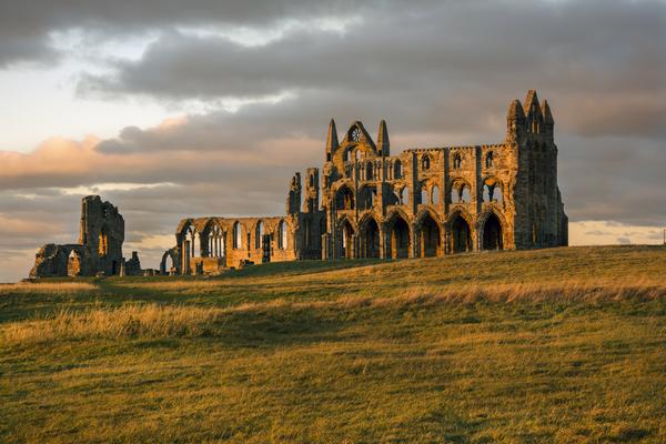Whitby Abbey at Sunset with dramatic cloudy sky behind