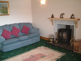Guests lounge with woodburning stove