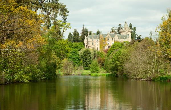Scots Baronial mansion Blair Drummond House seen from across the lake