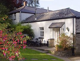 Seashell Cottage and patio in the cottage garden. 