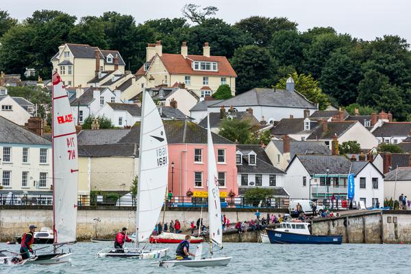 Saiiling dinghies in front of colourful cottages in Appledore, Devon