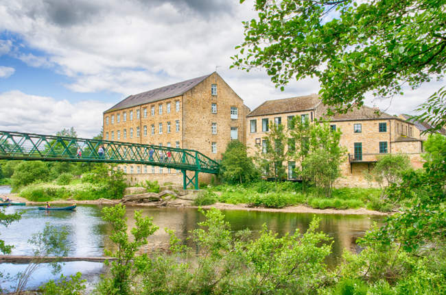 Old woollen mills by footbridge at Barnard Castle