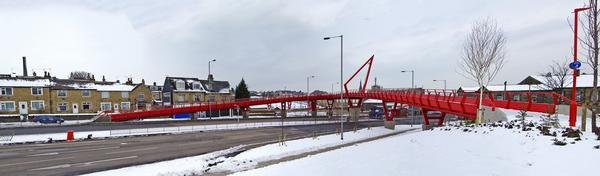 The distinctive red footbridge over the Manchester Road, in Bradford