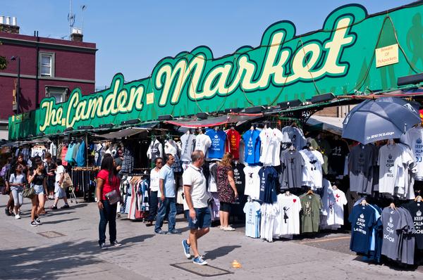People walk past the Camden Market in London.