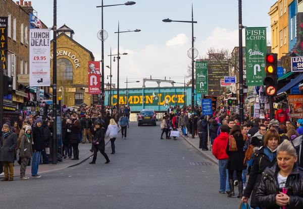 Busy shopping street in Camden Town during the day, with Camden Lock ahead