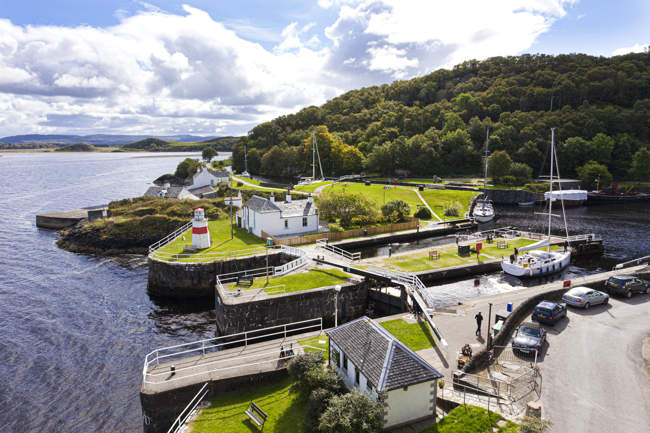 A yacht using the sea lock to enter the Crinan Canal Basin