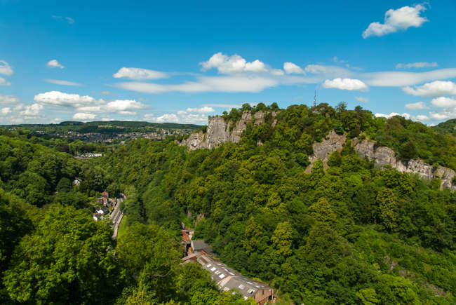 Climbing rocks and hills on a sunny day trip hiking