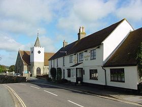 Looking down the High Street. Pointer Inn pub, Clematis self-catering lodging and All Saints Church built in 11 century. &copy; Mark Lansbury