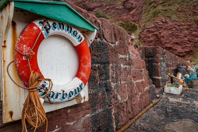 Lifebuoy and fishing gear at Pennan Harbour
