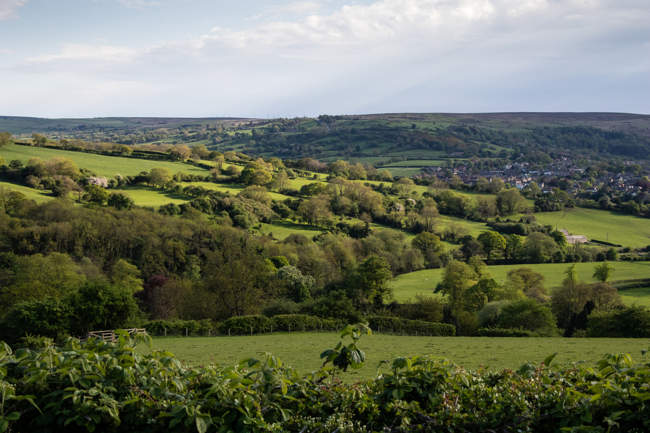 A view over rolling countryside, farmland and fields in Ruswarp