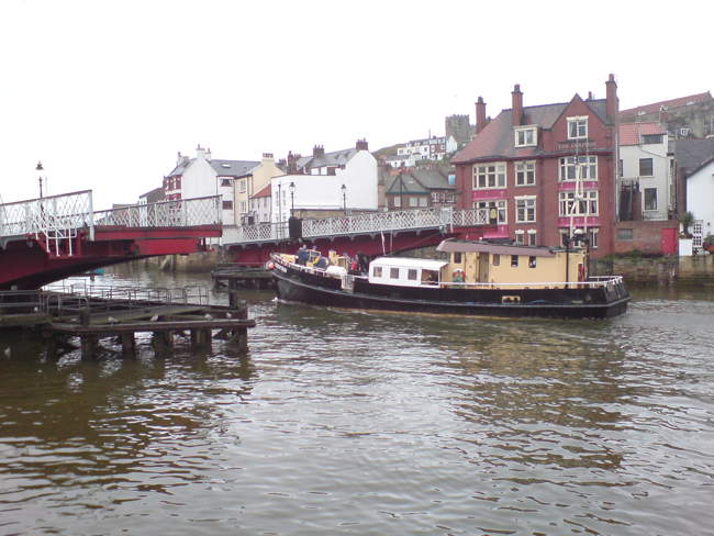 Boat leaving Whitby harbour through the swing bridge &copy;  Chris Watson   